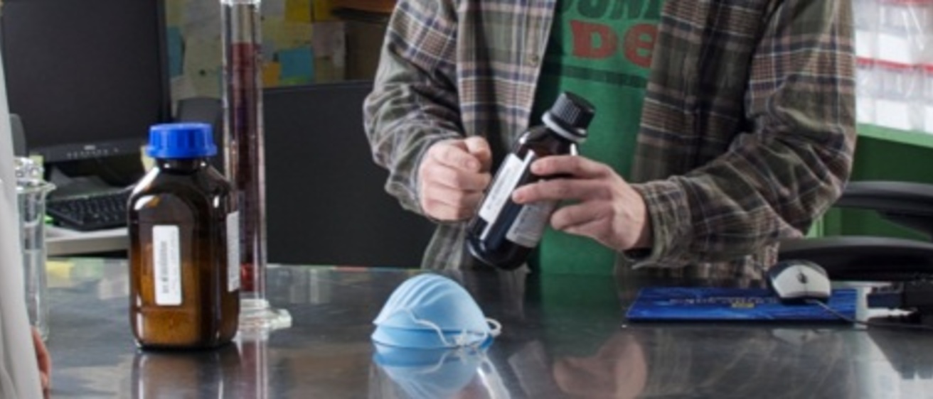 Customer being shown a chemical